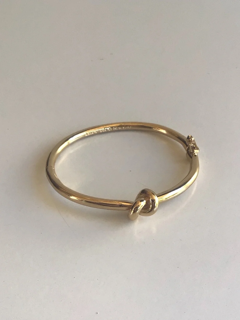 Kate Spade gold knot bangle bracelet